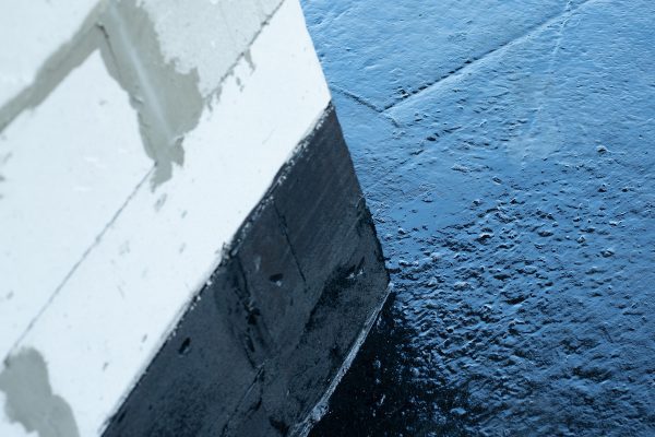 Bituminous tanking membrane applied to a block wall and floor junction — a Type A barrier system